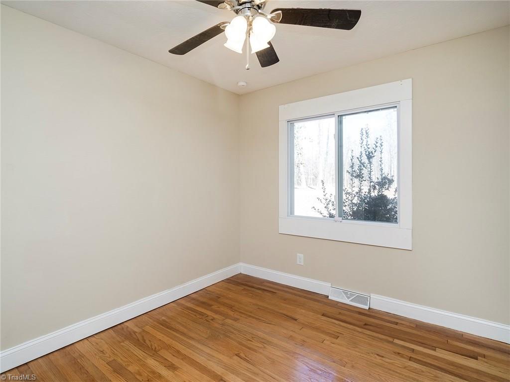 209 Edgeview Road High Point, NC 27260 - Photo 11 of 20 Second bedroom with hard wood flooring, ceiling fan, large windows for added natural lighting. Large attache closet.