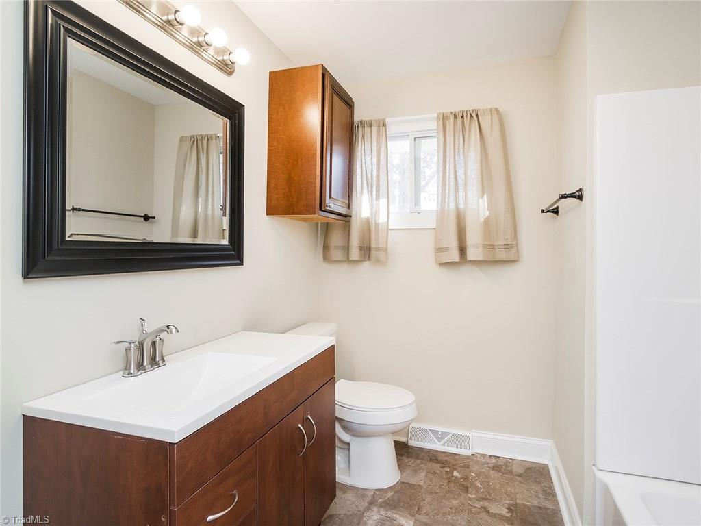 209 Edgeview Road High Point, NC 27260 - Photo 13 of 20 Beautiful hall bathroom with shower tub combo. Easy to clean vinyl flooring, window for added natural lighting, large vanity with tons of counter and storage space.