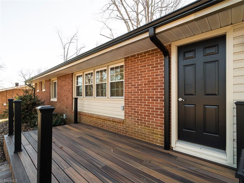 209 Edgeview Road High Point, NC 27260 - Photo 17 of 20 Spacious back deck looking over large back yard with storage building. Direct access to laundry room.