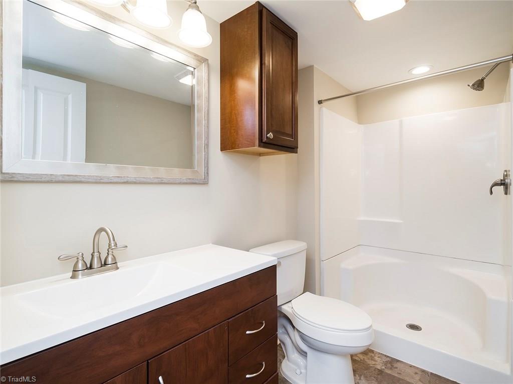 209 Edgeview Road High Point, NC 27260 - Photo 10 of 20 Beautiful master bath with stand alone shower. Large vanity with tons of counter and storage space. Easy to clean vinyl flooring. Easy access to master bedroom and laundry room.