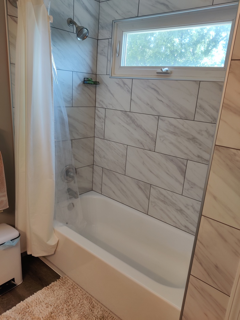 1681 Boulder Ridge Drive Bolingbrook, IL 60490 - Photo 16 of 17 a bathroom with a bathtub and a toilet