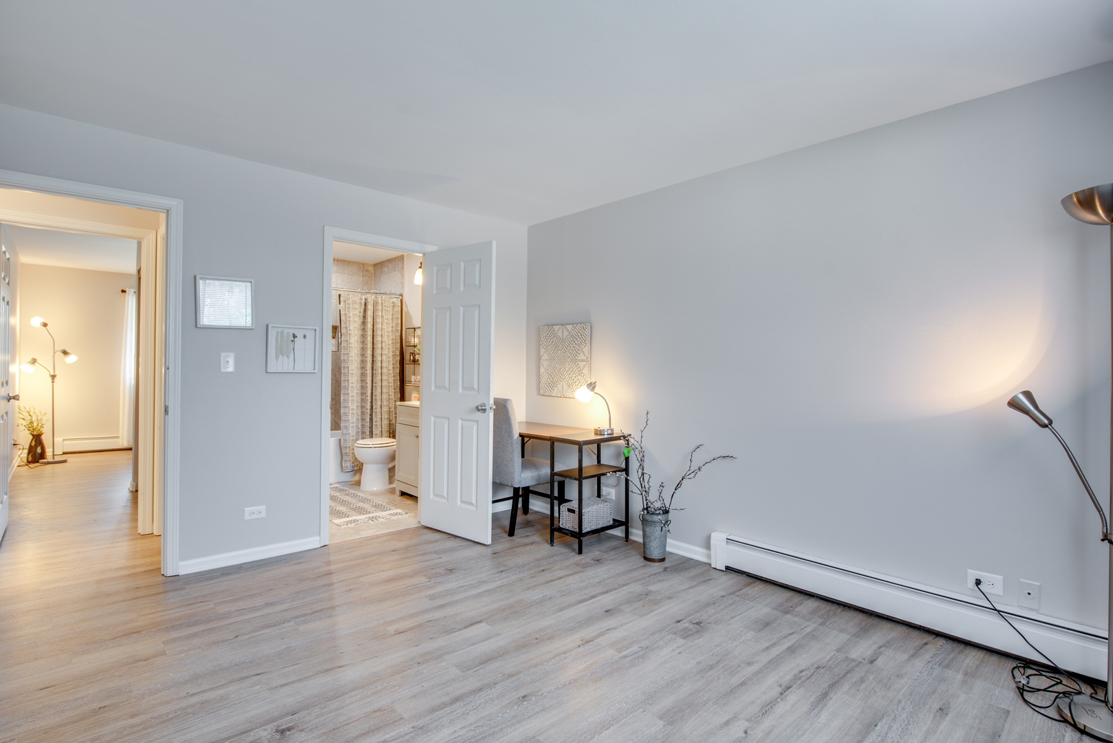 420 Echo Lane, Unit 101 Aurora, IL 60504 - Photo 12 of 16 an empty room with wooden floor and a window