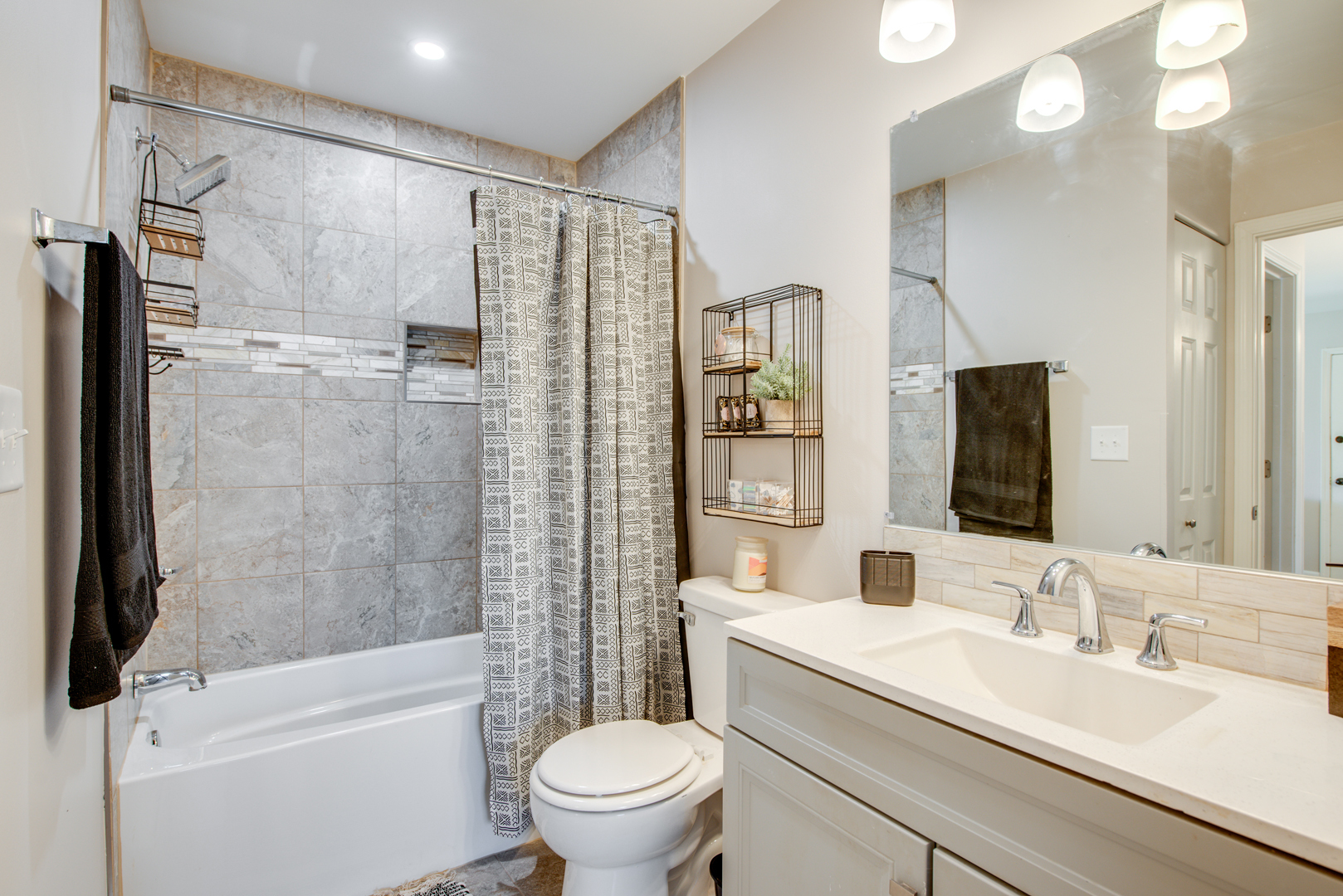 420 Echo Lane, Unit 101 Aurora, IL 60504 - Photo 15 of 16 a bathroom with a granite countertop sink toilet and shower