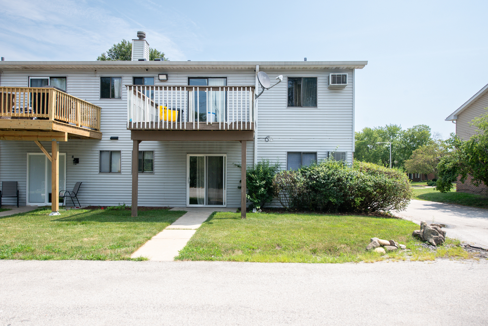 420 Echo Lane, Unit 101 Aurora, IL 60504 - Photo 16 of 16 a front view of a house with a yard