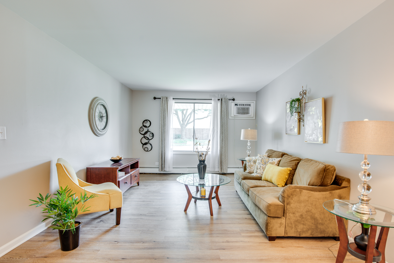 420 Echo Lane, Unit 101 Aurora, IL 60504 - Photo 2 of 16 a living room with furniture and a large window