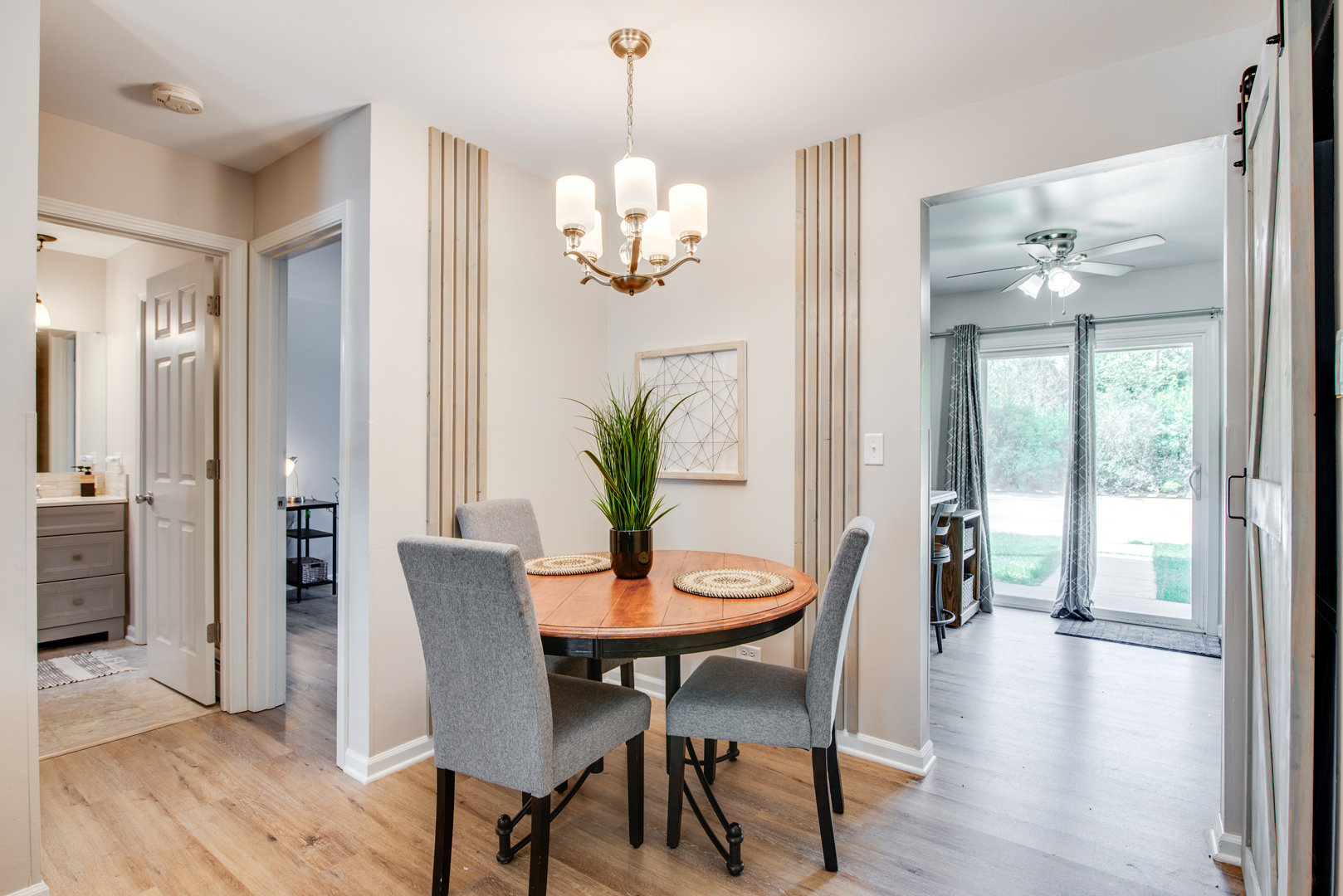 420 Echo Lane, Unit 101 Aurora, IL 60504 - Photo 7 of 16 a view of a dining room with furniture wooden floor and chandelier
