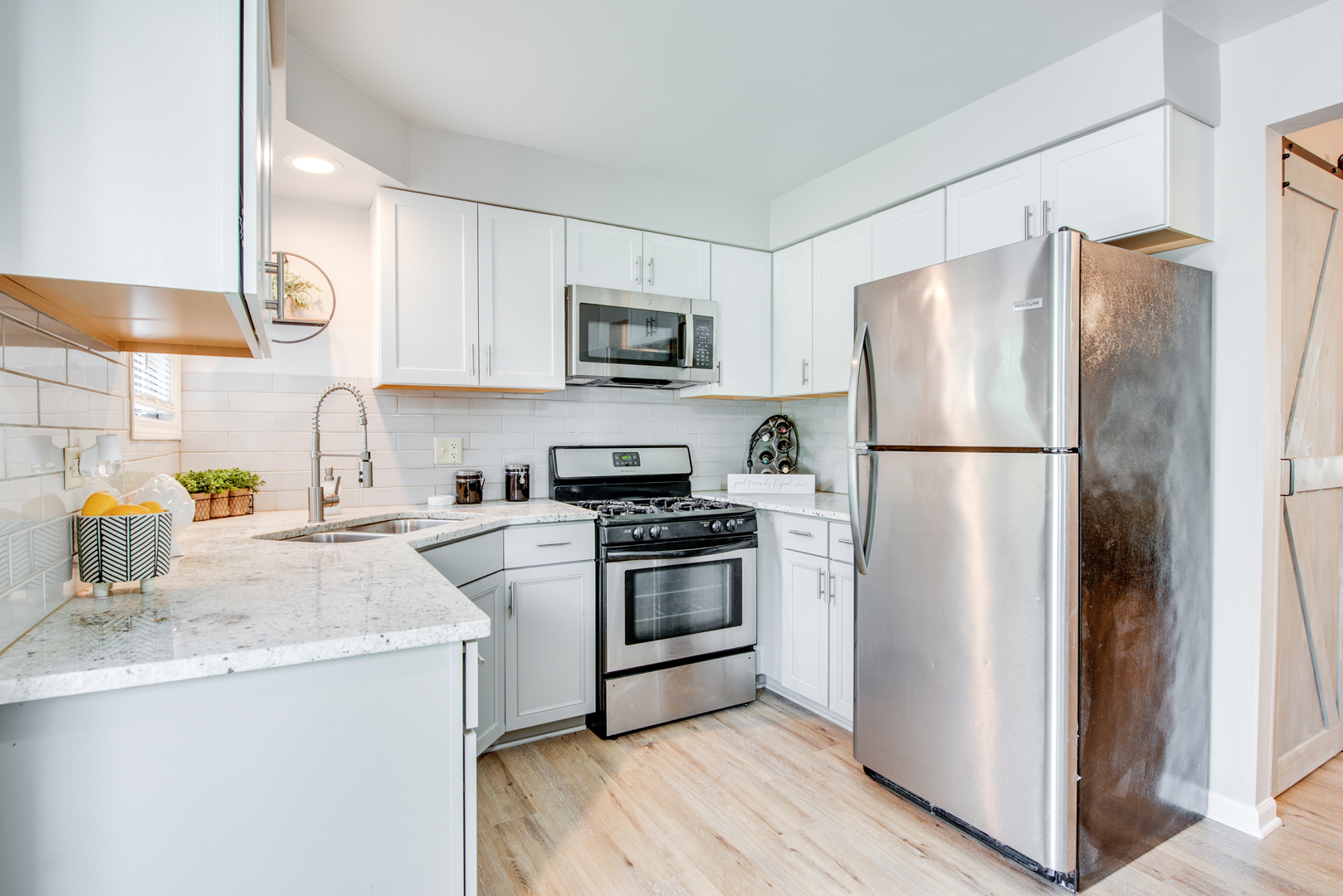 420 Echo Lane, Unit 101 Aurora, IL 60504 - Photo 9 of 16 a kitchen with a refrigerator sink and stove