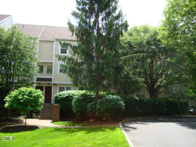 97 Highland Road Stamford, CT 06901 - Photo 1 of 1 a front view of house with yard and green space