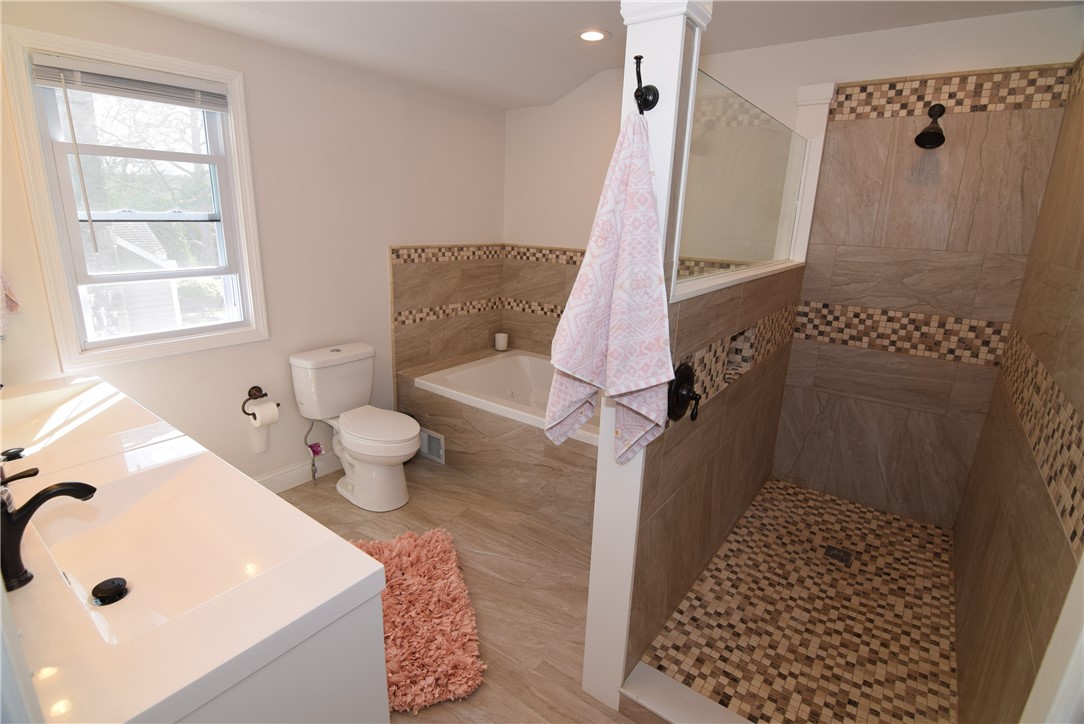 8 Lima Drive Westerly, RI 02891 - Photo 13 of 42 Master suite walking shower and separate jacuzzi style tub and his and her sinks.