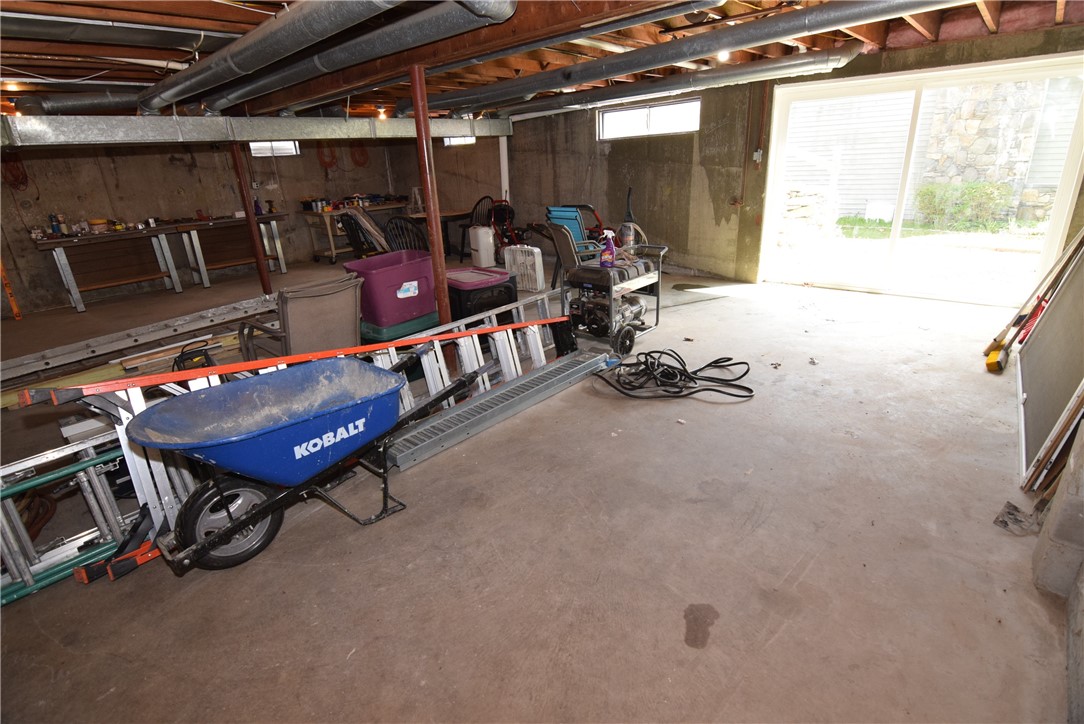 8 Lima Drive Westerly, RI 02891 - Photo 38 of 42 Huge basement with sliding glass doors to outside ready for your finished basement if you need it or just use as a huge workshop area.