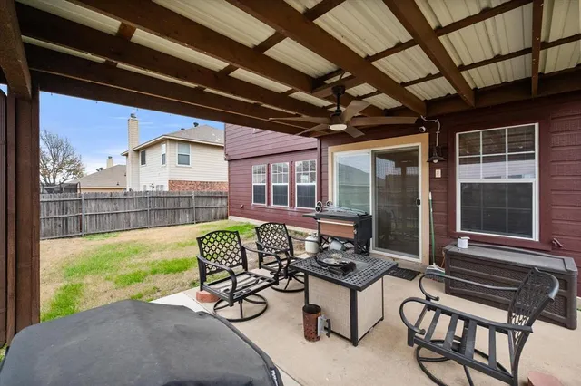 a balcony with furniture and a window