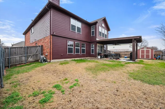 a front view of a house with a yard and porch