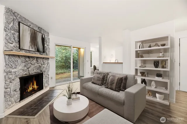 a living room with furniture and a fireplace