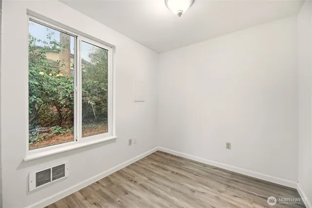 a kitchen with a sink a stove cabinets and a refrigerator