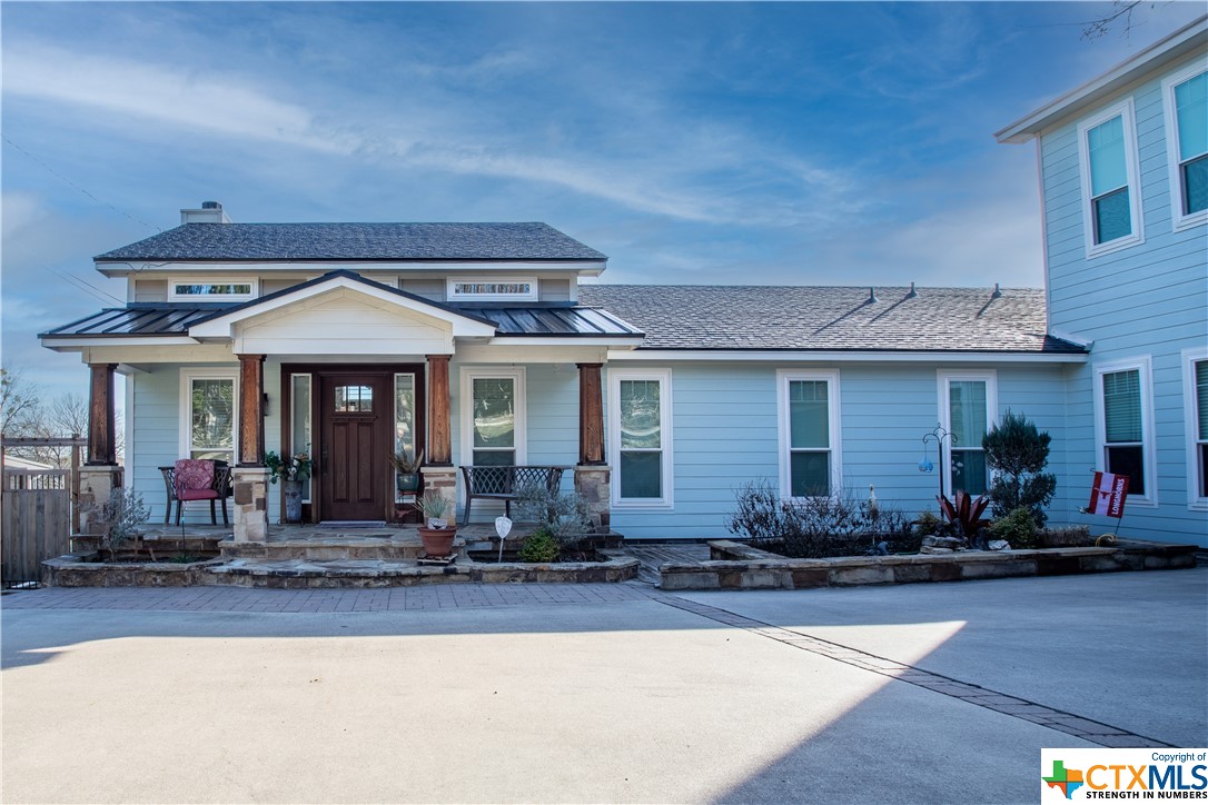 13325 Rattlesnake Road Belton, TX 76513 - Photo 1 of 1 a front view of a house with lots of windows and chairs