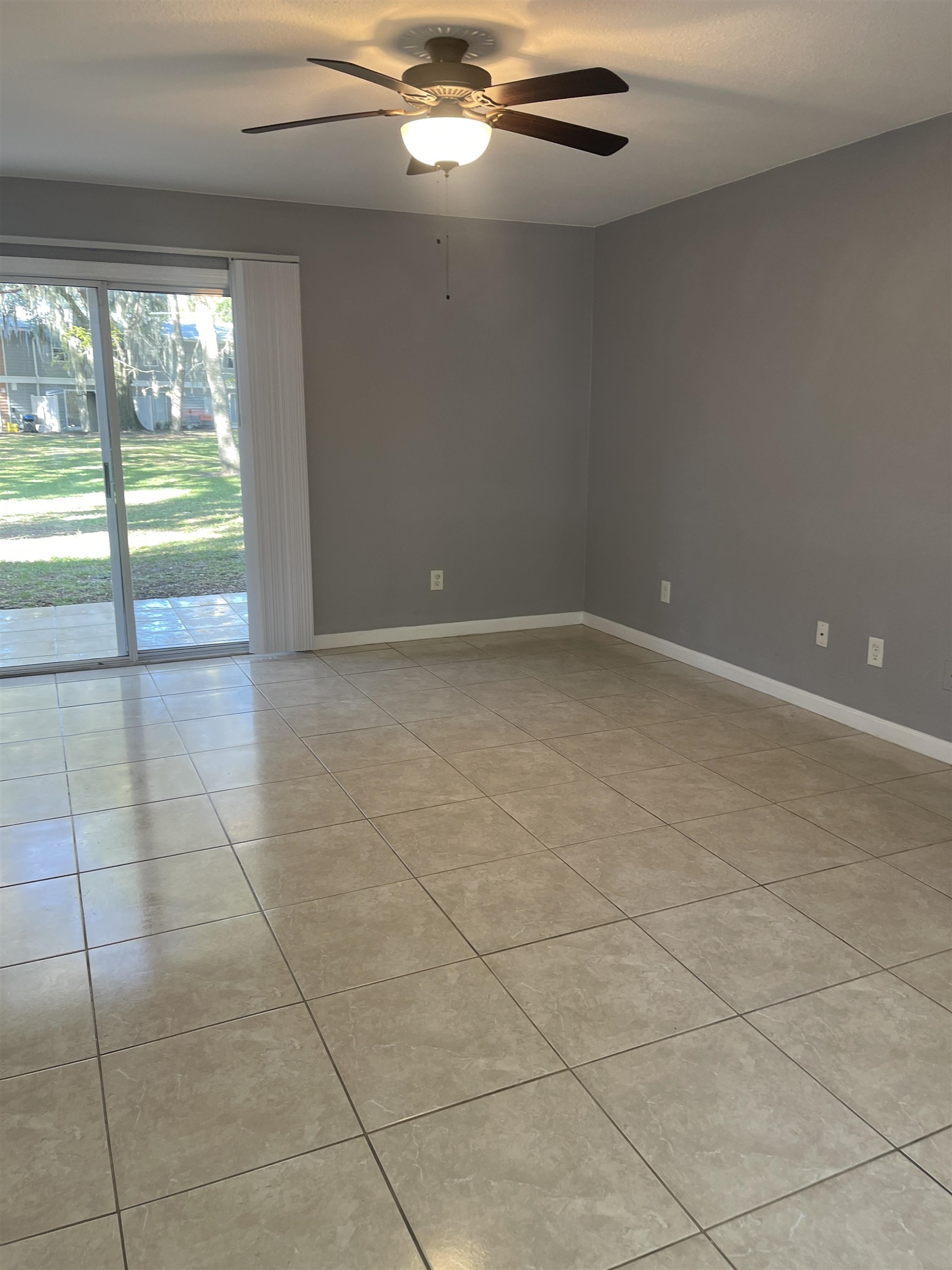 4420 Carter Road, Unit 58 St. Augustine, FL 32086 - Photo 4 of 13 a view of an empty room with a window