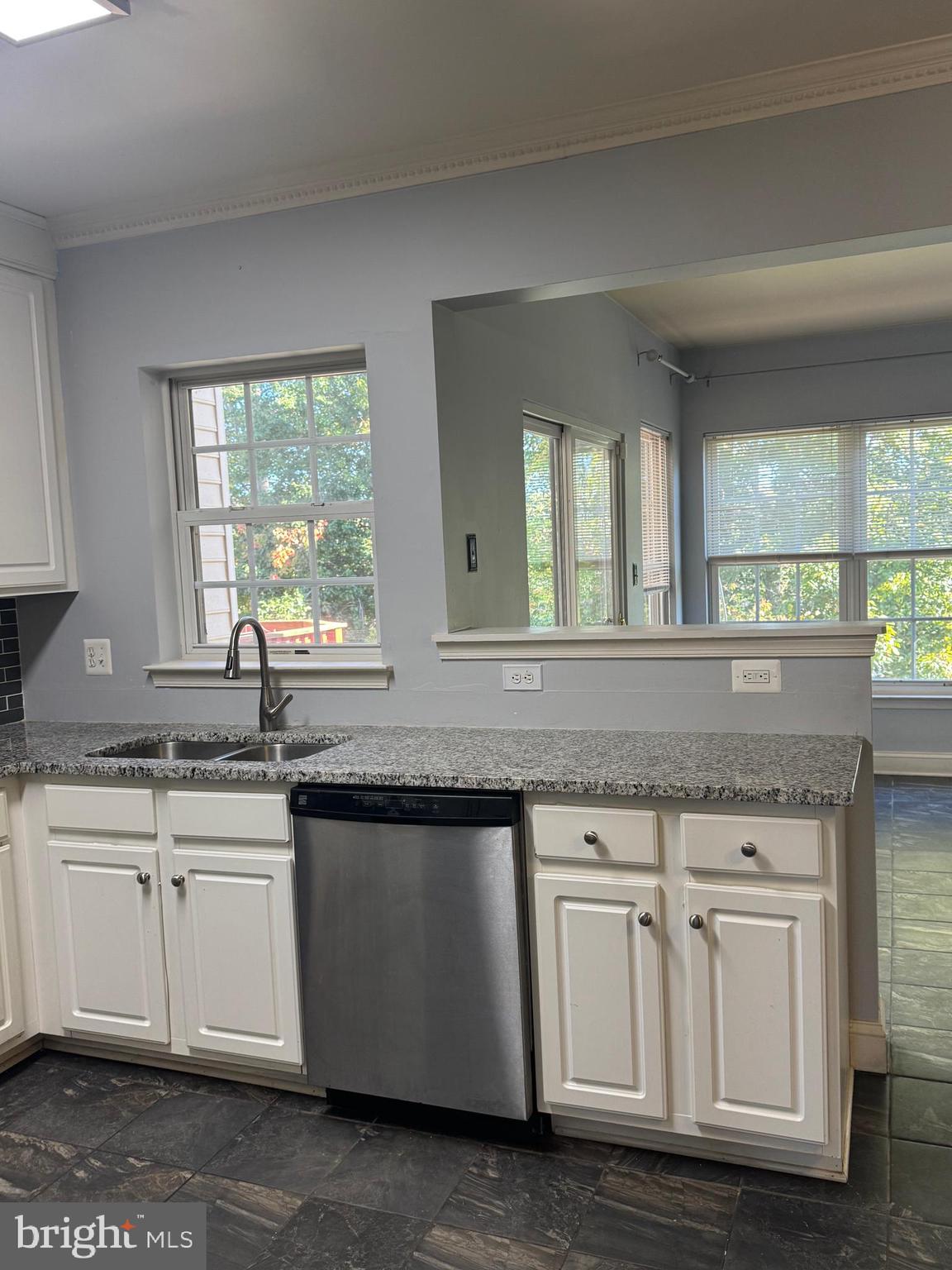 3850 Koval Lane Woodbridge, VA 22192 - Photo 18 of 61 a kitchen with white cabinets and sink
