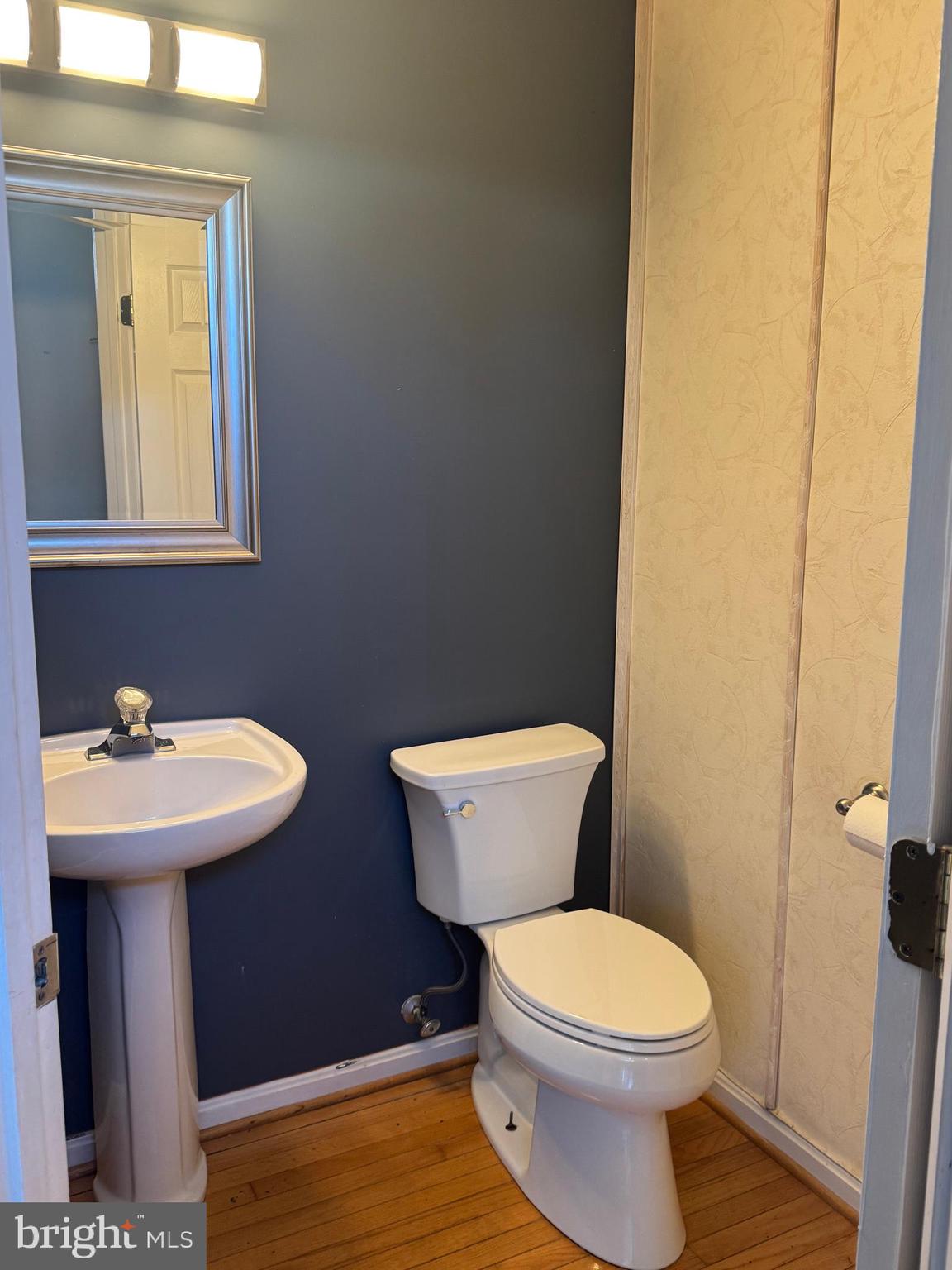 3850 Koval Lane Woodbridge, VA 22192 - Photo 23 of 61 a bathroom with a sink a toilet and mirror
