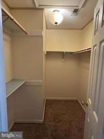 a bathroom with a tub and window