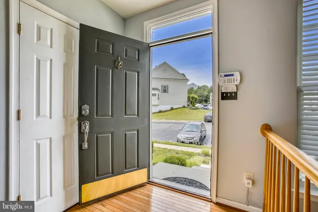a living room with furniture wooden floor and a flat screen tv