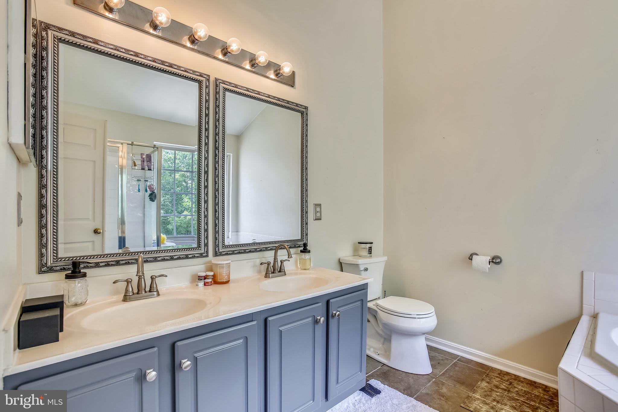 3850 Koval Lane Woodbridge, VA 22192 - Photo 30 of 61 a bathroom with a sink and a mirror