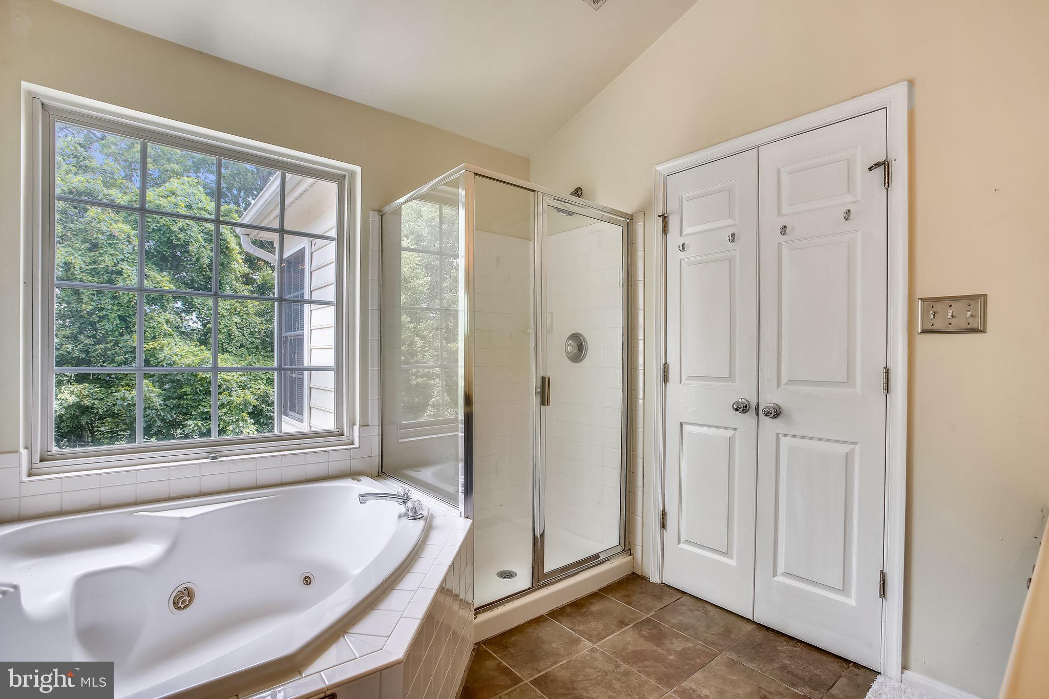 3850 Koval Lane Woodbridge, VA 22192 - Photo 31 of 61 a bathroom with a tub and a shower