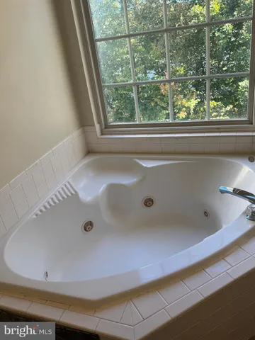 a bathroom with a toilet and a shower curtain