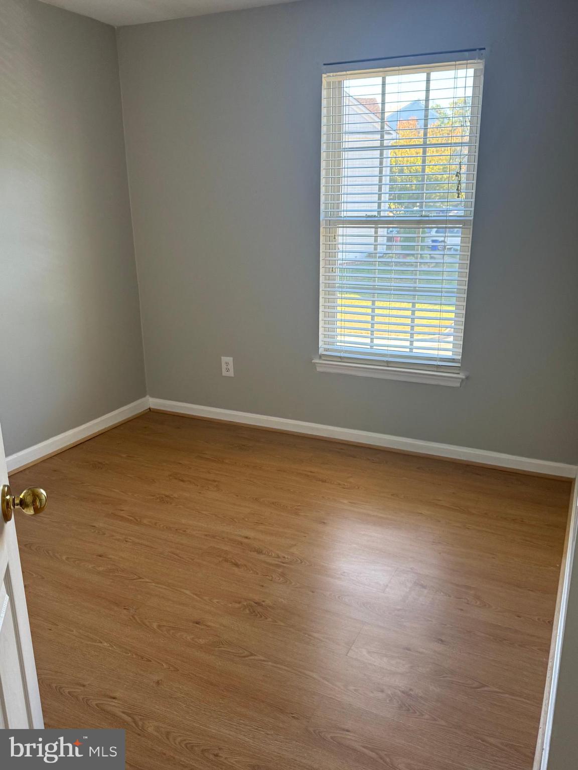 3850 Koval Lane Woodbridge, VA 22192 - Photo 34 of 61 an empty room with wooden floor and windows