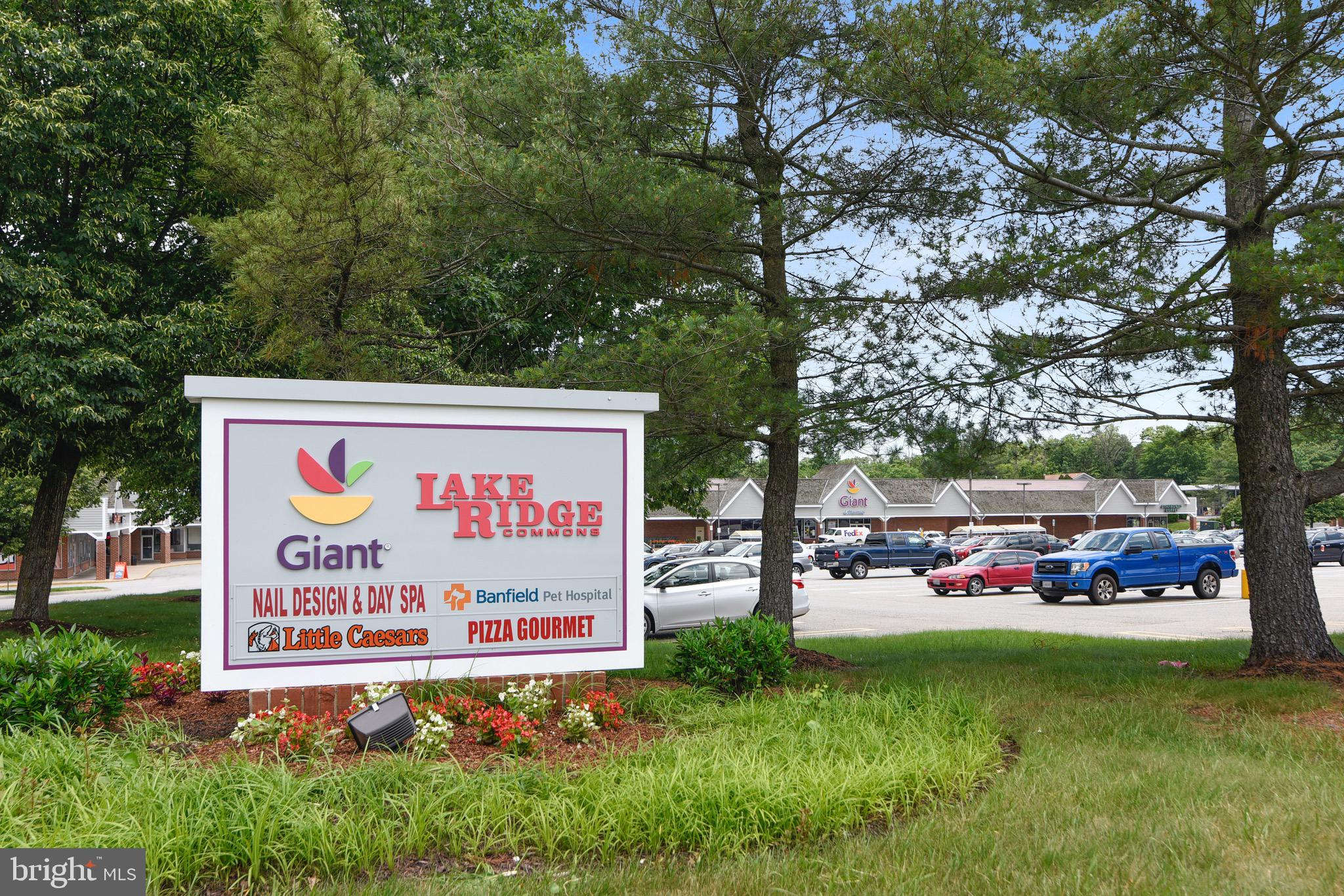 3850 Koval Lane Woodbridge, VA 22192 - Photo 48 of 61 a sign that is in front of the tree
