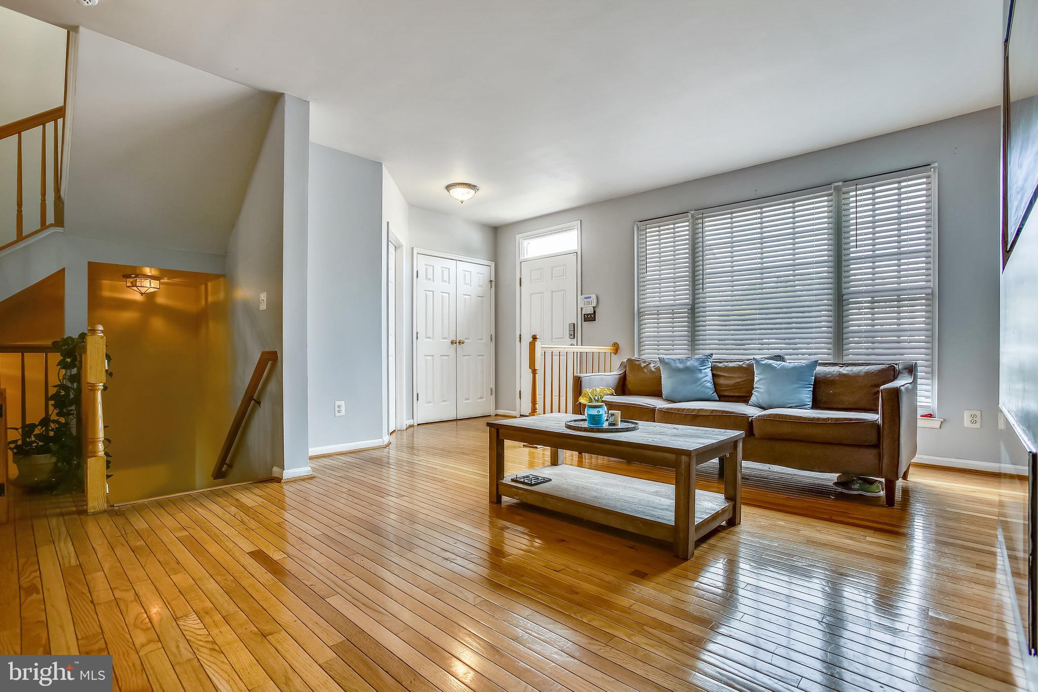 3850 Koval Lane Woodbridge, VA 22192 - Photo 5 of 61 a living room with furniture and a wooden floor