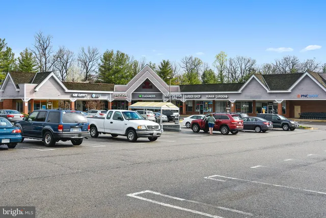 a view of a parking space with couple of trees