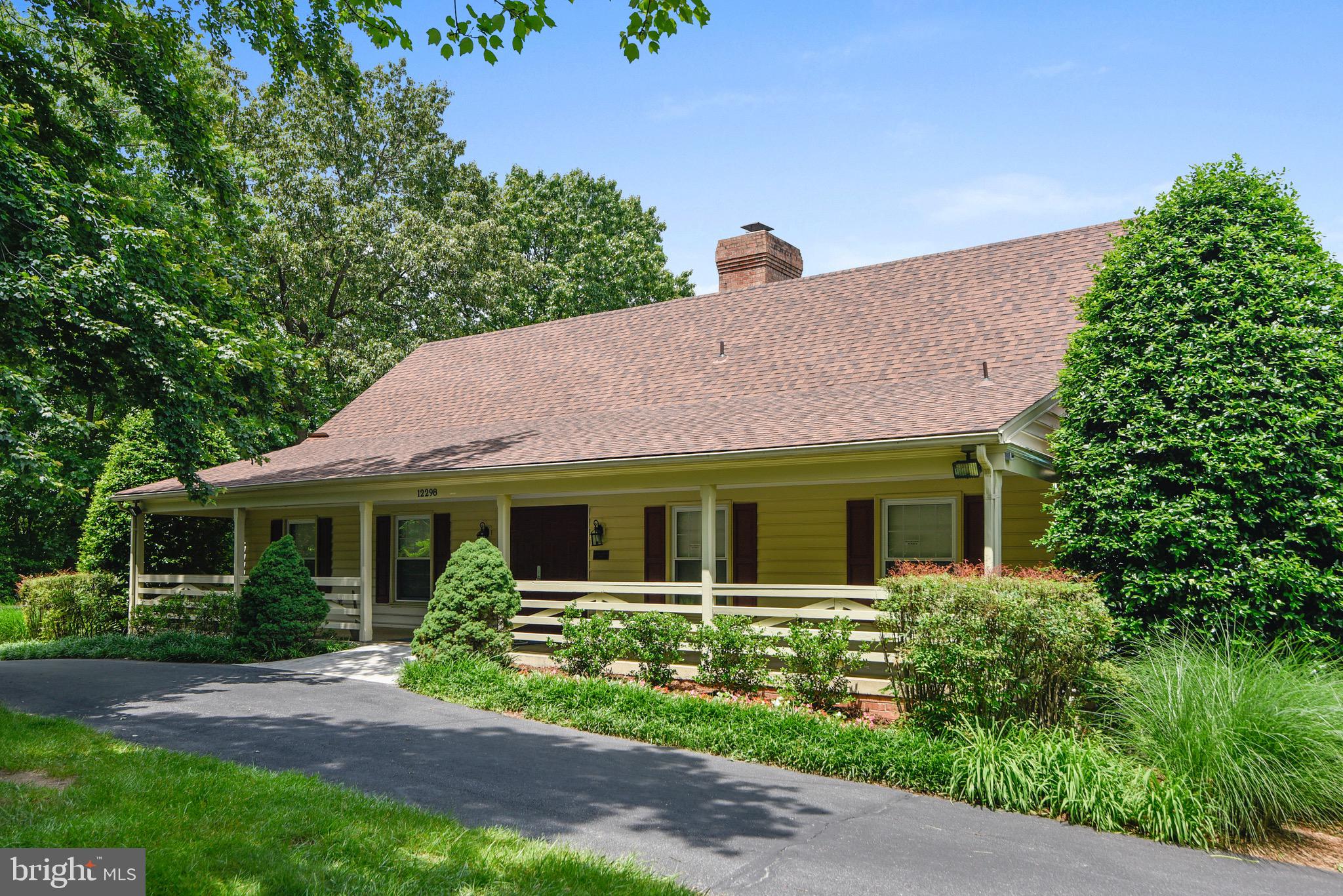 3850 Koval Lane Woodbridge, VA 22192 - Photo 51 of 61 a front view of a house with a garden