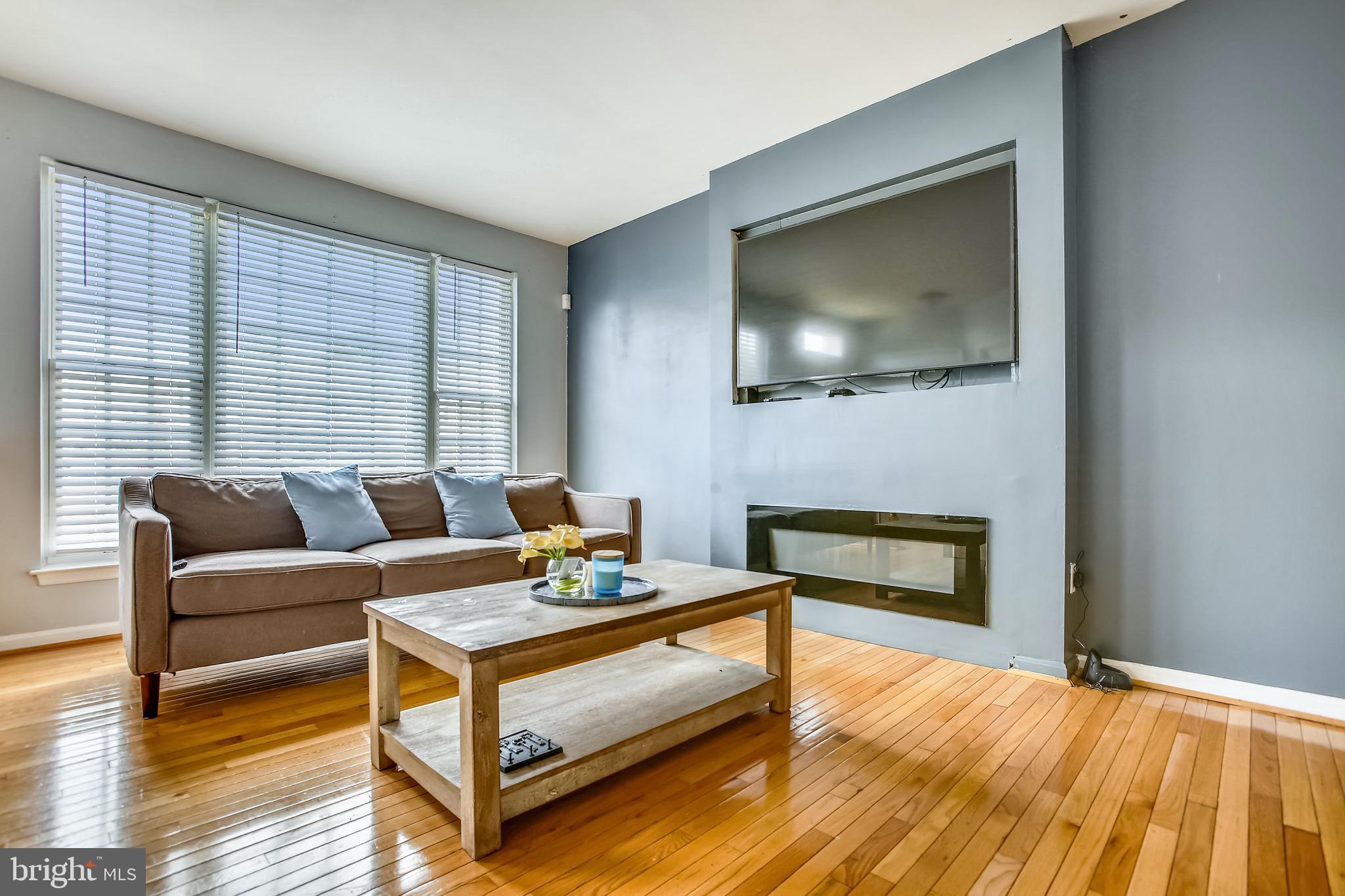 3850 Koval Lane Woodbridge, VA 22192 - Photo 6 of 61 a living room with furniture and a flat screen tv