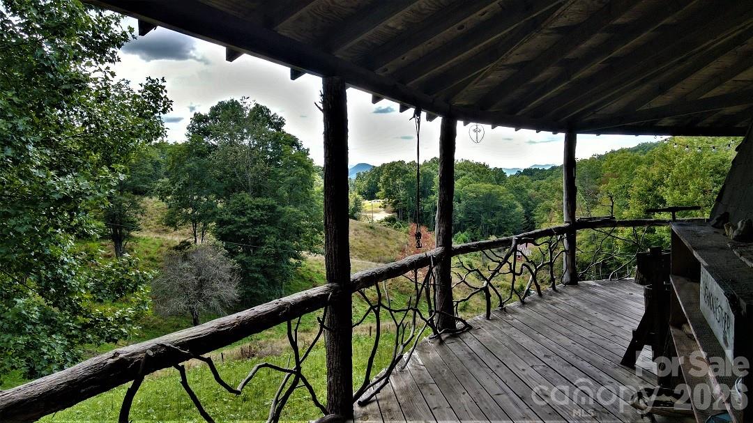 745 Broom Road Tuckasegee, NC 28783 - Photo 11 of 42 a view of a balcony with wooden floor