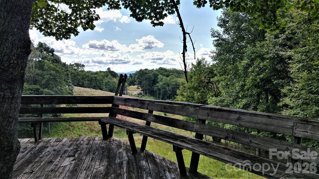 745 Broom Road Tuckasegee, NC 28783 - Photo 13 of 42 a view of a bench in a balcony