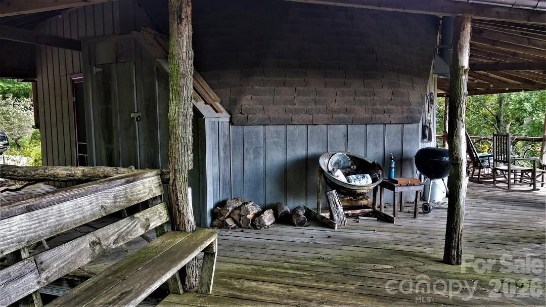 745 Broom Road Tuckasegee, NC 28783 - Photo 16 of 42 a backyard of a house with table and chairs