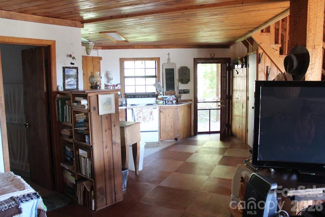 745 Broom Road Tuckasegee, NC 28783 - Photo 19 of 42 a kitchen with stainless steel appliances granite countertop a refrigerator and a sink