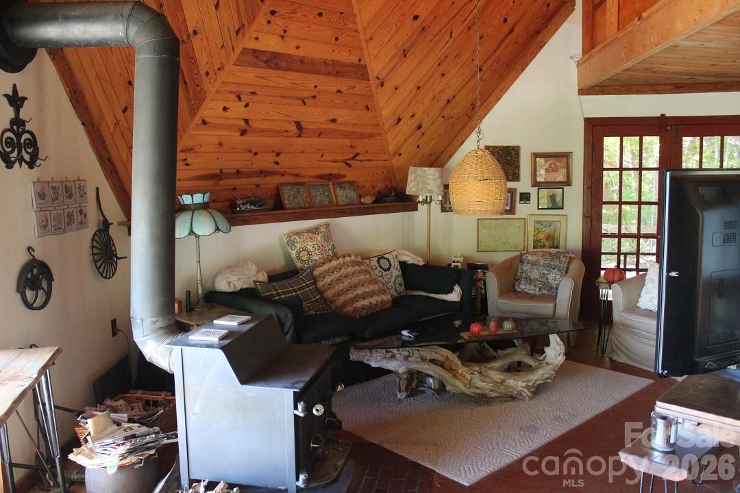 745 Broom Road Tuckasegee, NC 28783 - Photo 20 of 42 a living room with furniture and a window