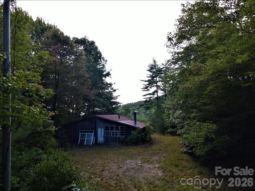 745 Broom Road Tuckasegee, NC 28783 - Photo 37 of 42 a view of a house with a yard