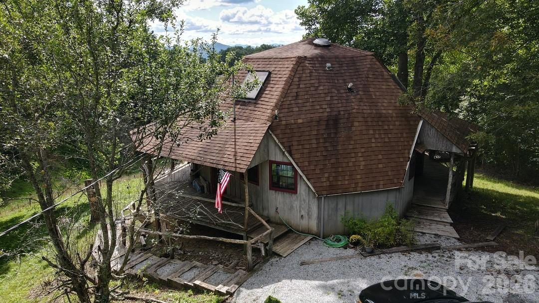 745 Broom Road Tuckasegee, NC 28783 - Photo 7 of 42 a front view of a house with garden