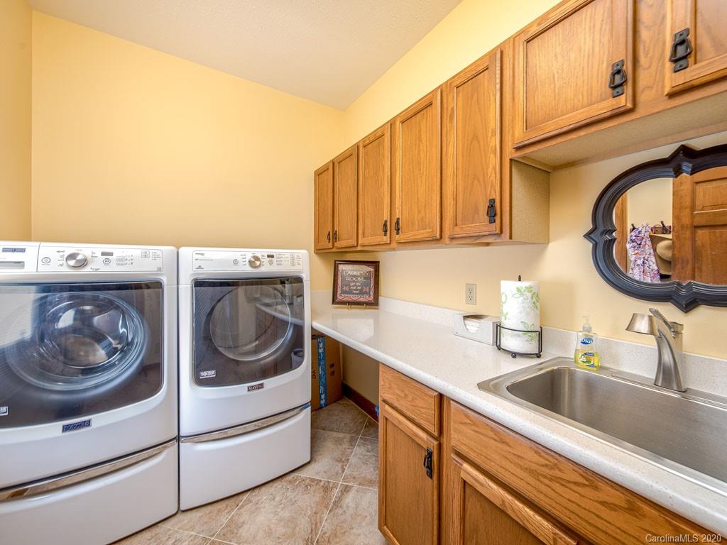 270 Country Ridge Road Laurel Park, NC 28739 - Photo 15 of 39 a utility room with sink dryer and washer