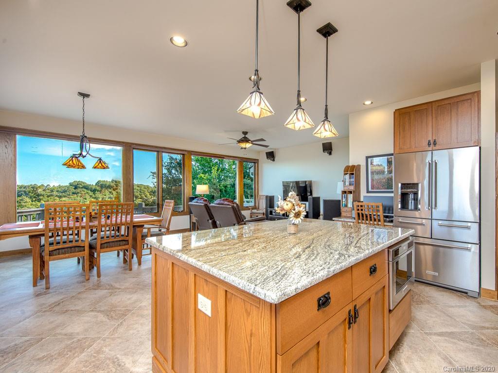 270 Country Ridge Road Laurel Park, NC 28739 - Photo 18 of 39 a large kitchen with kitchen island a large island in it