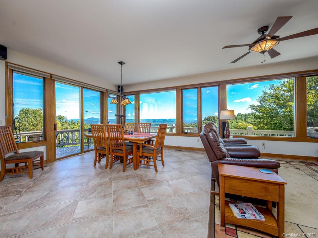 270 Country Ridge Road Laurel Park, NC 28739 - Photo 20 of 39 a view of a dining room with furniture window and outside view