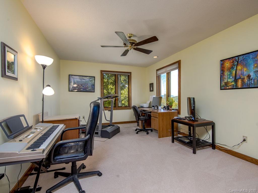 270 Country Ridge Road Laurel Park, NC 28739 - Photo 23 of 39 a view of a workspace with furniture and a window