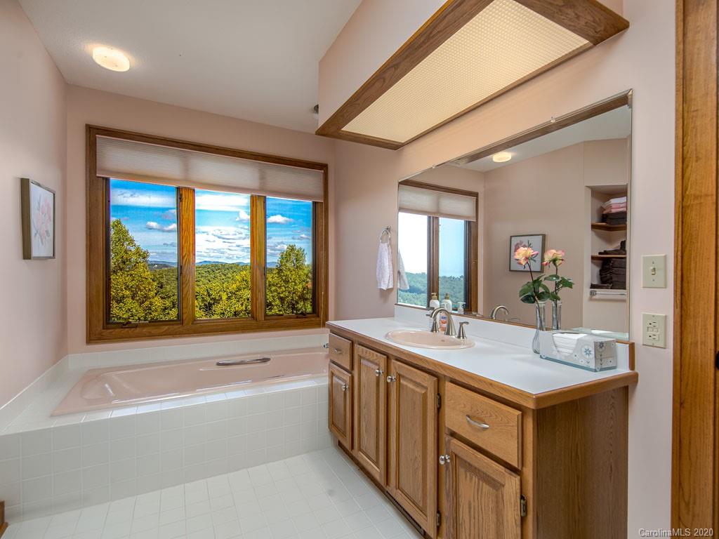 270 Country Ridge Road Laurel Park, NC 28739 - Photo 24 of 39 a bathroom with a sink and a bathtub