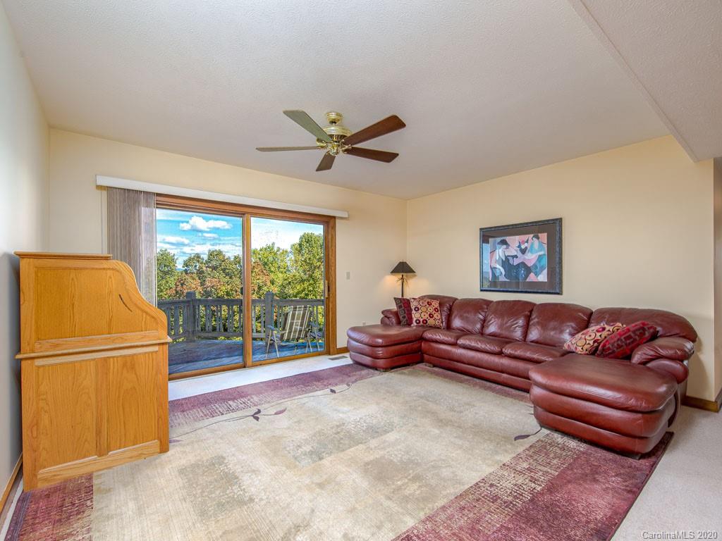 270 Country Ridge Road Laurel Park, NC 28739 - Photo 26 of 39 a living room with furniture and a large window