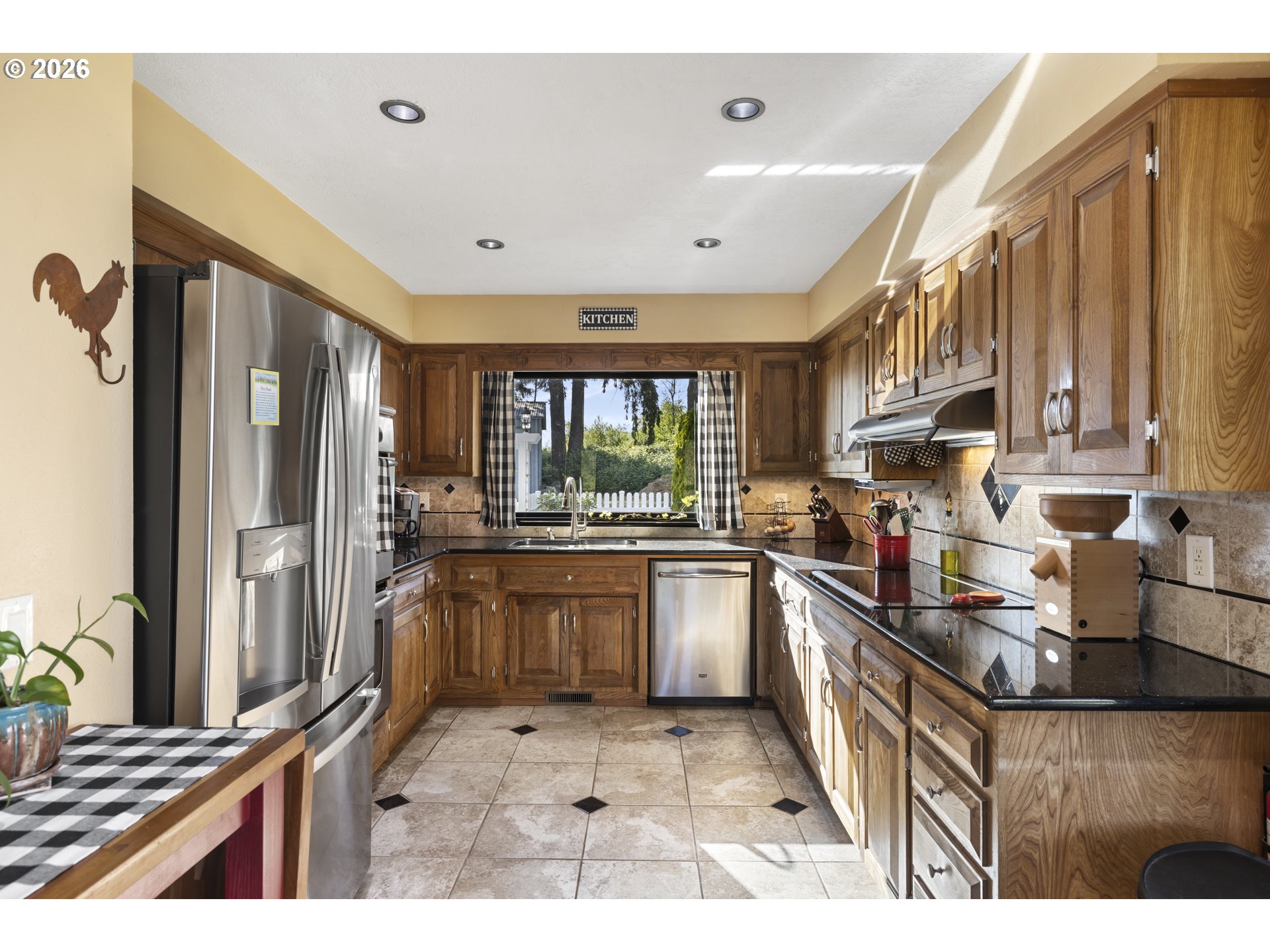 4515 Cordon Road Northeast Salem, OR 97305 - Photo 5 of 48 a kitchen with stainless steel appliances granite countertop sink refrigerator and window