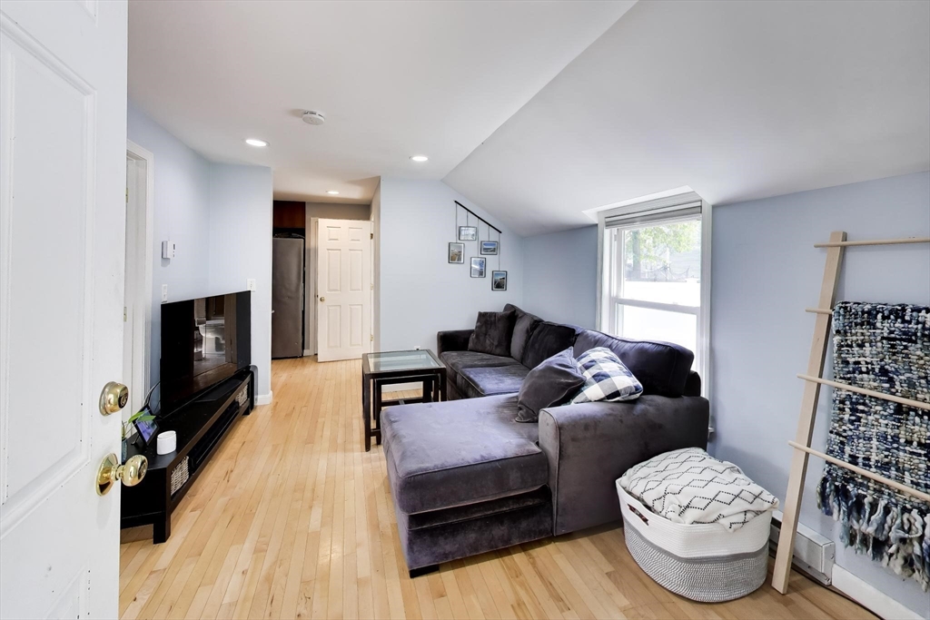 22 Douglas Road Ashland, MA 01721 - Photo 5 of 24 a living room with furniture and a flat screen tv