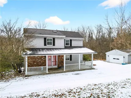 a front view of a house with a porch