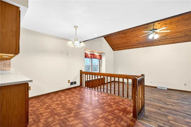 a living room with furniture or stairs and a wooden floor